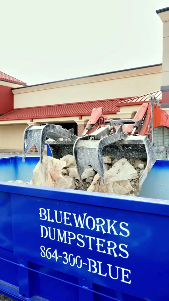 Roll-off dumpster delivered on a job site