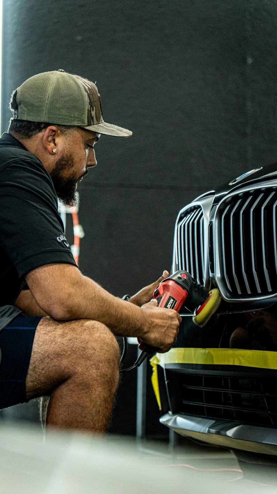 Detailer machine polishing a BMW